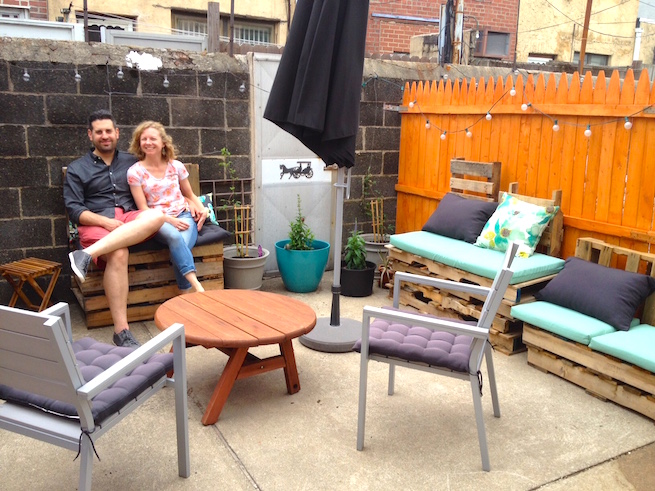 Dave and Leah enjoying the "pop-up beer garden"-style backyard furniture designed by Leah and built by Dave