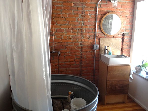 There's a first time for everything: galvanized cattle feeding trough as shower basin