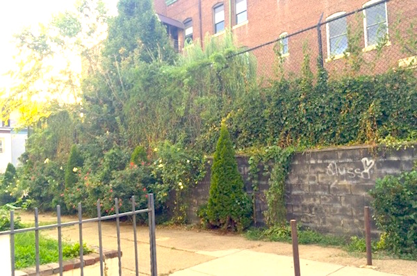 The Holy Name schoolyard now occupies the southeastern side of the block where five additional rowhomes once stood