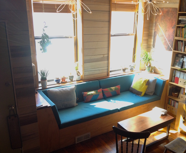 The custom built-in window seat in the living room, which cleverly conceals ductwork for the HVAC system