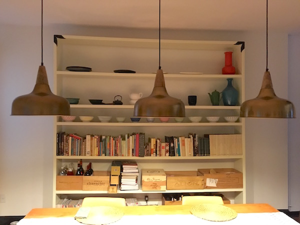 The dining room from a different perspective: plenty of shelving throughout the house to display Kimberly & Latrice's many books, ceramics, and other objet d'arte