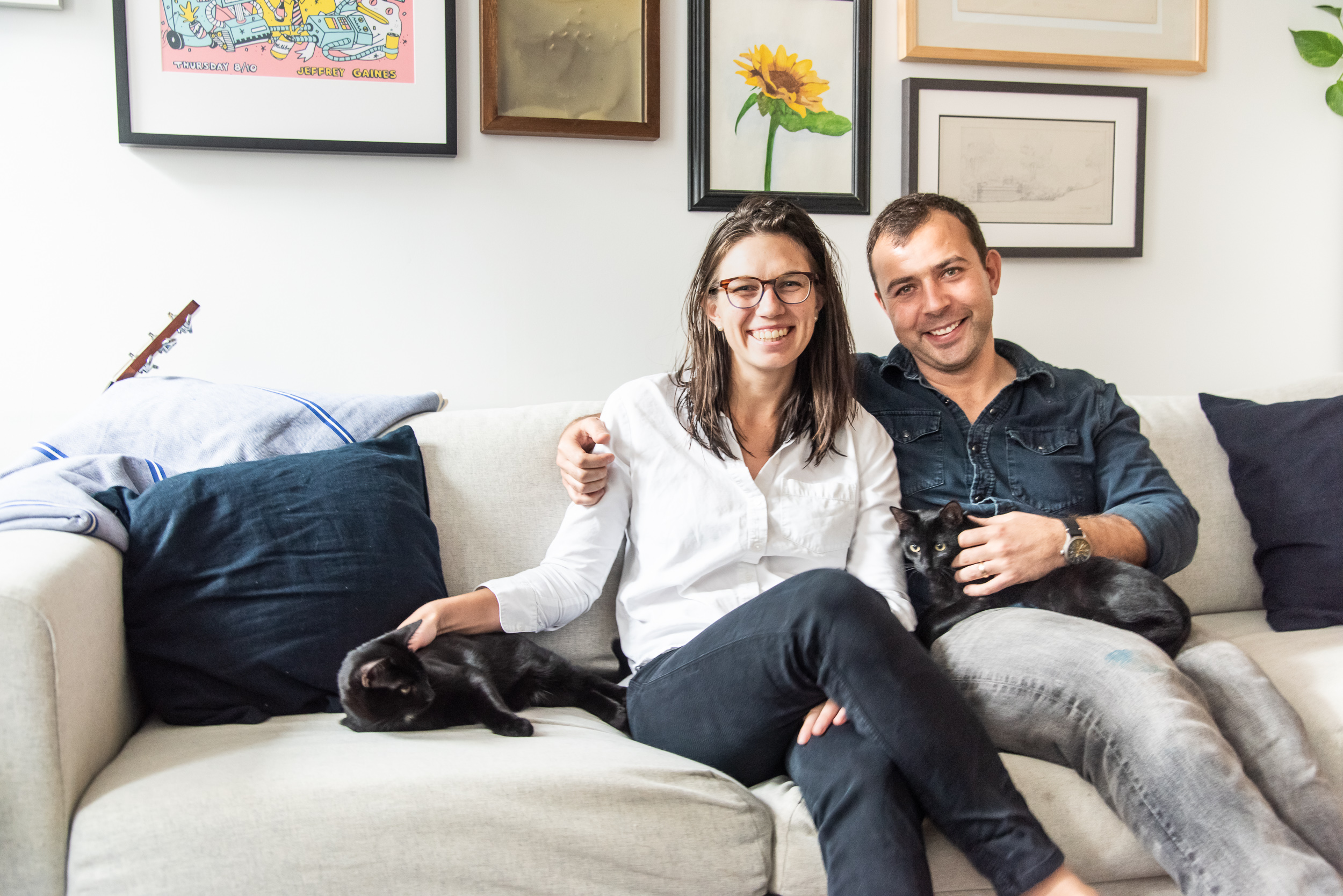 Couple on a sofa in their Philadelphia Rowhome