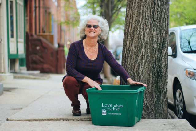 Deborah Solo with a recycling bin. 