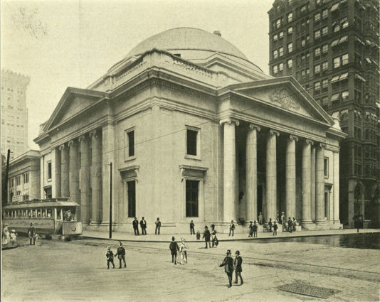 Halftone reproduction of photograph of the Girard Trust Company building situated on the corner of Broad and Chestnut. Built between 1905 and 1908, and designed in the neo classical revival style by Furness, Evans & Co. and later finished by McKim, Mead & White. In 2000, the building was converted into the Ritz-Carlton Hotel. Image: Free Library of Philadelphia.