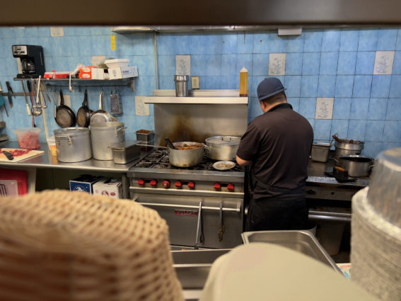 Salvador working in the kitchen at La Capital Mexican Grill