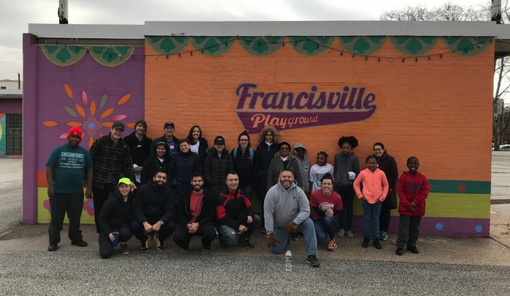 A group of volunteers during an MLK volunteer event at the Francisville Playground.