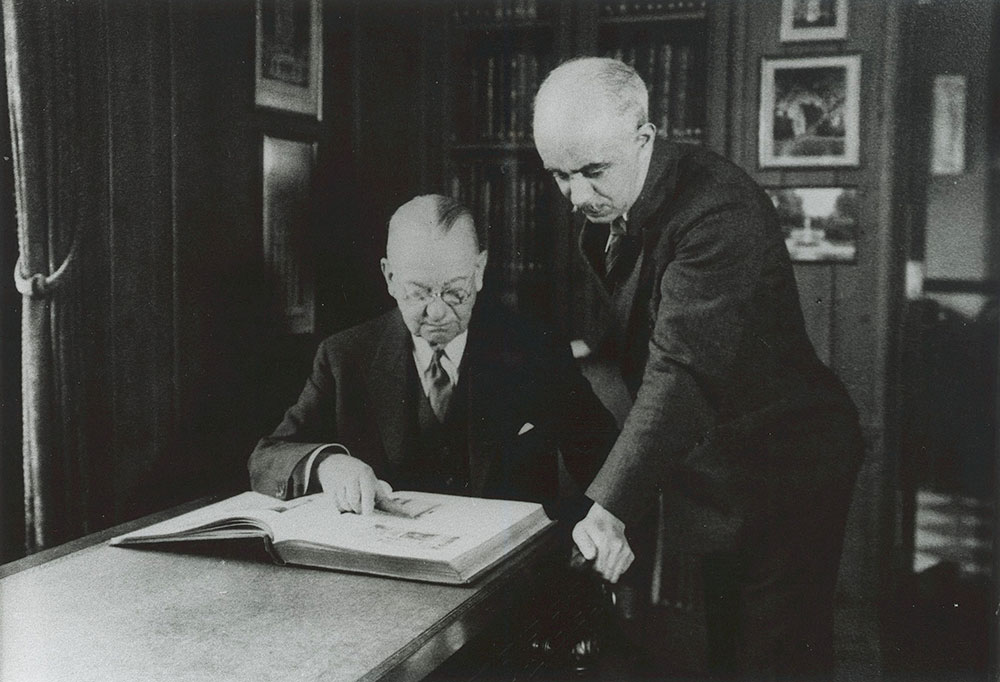 Horace Trumbauer and Julian Abele perusing an architecture book in the mid 1930's. Image: Free Library.